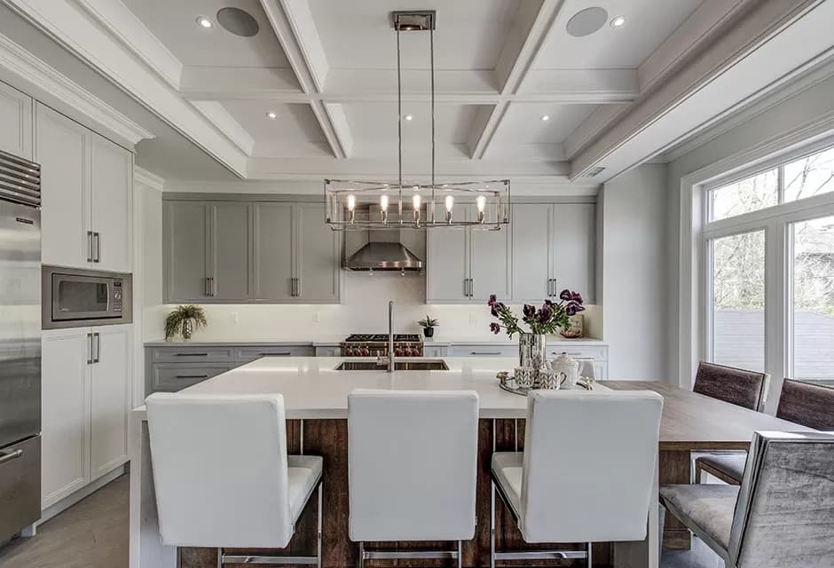 A collage of three interior spaces featuring elegant coffered ceilings in a dining room