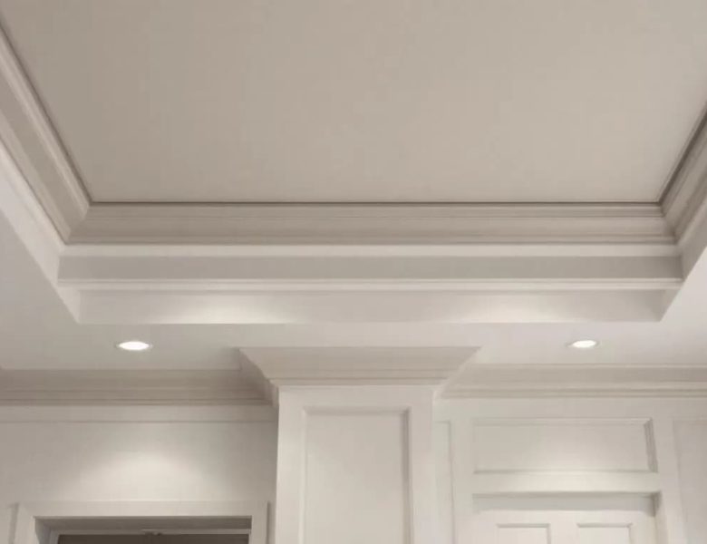 A beautifully designed tray ceiling showcasing intricate crown molding.