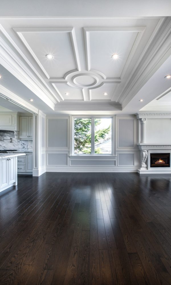 Interior spaces featuring elegant coffered ceilings in a living room